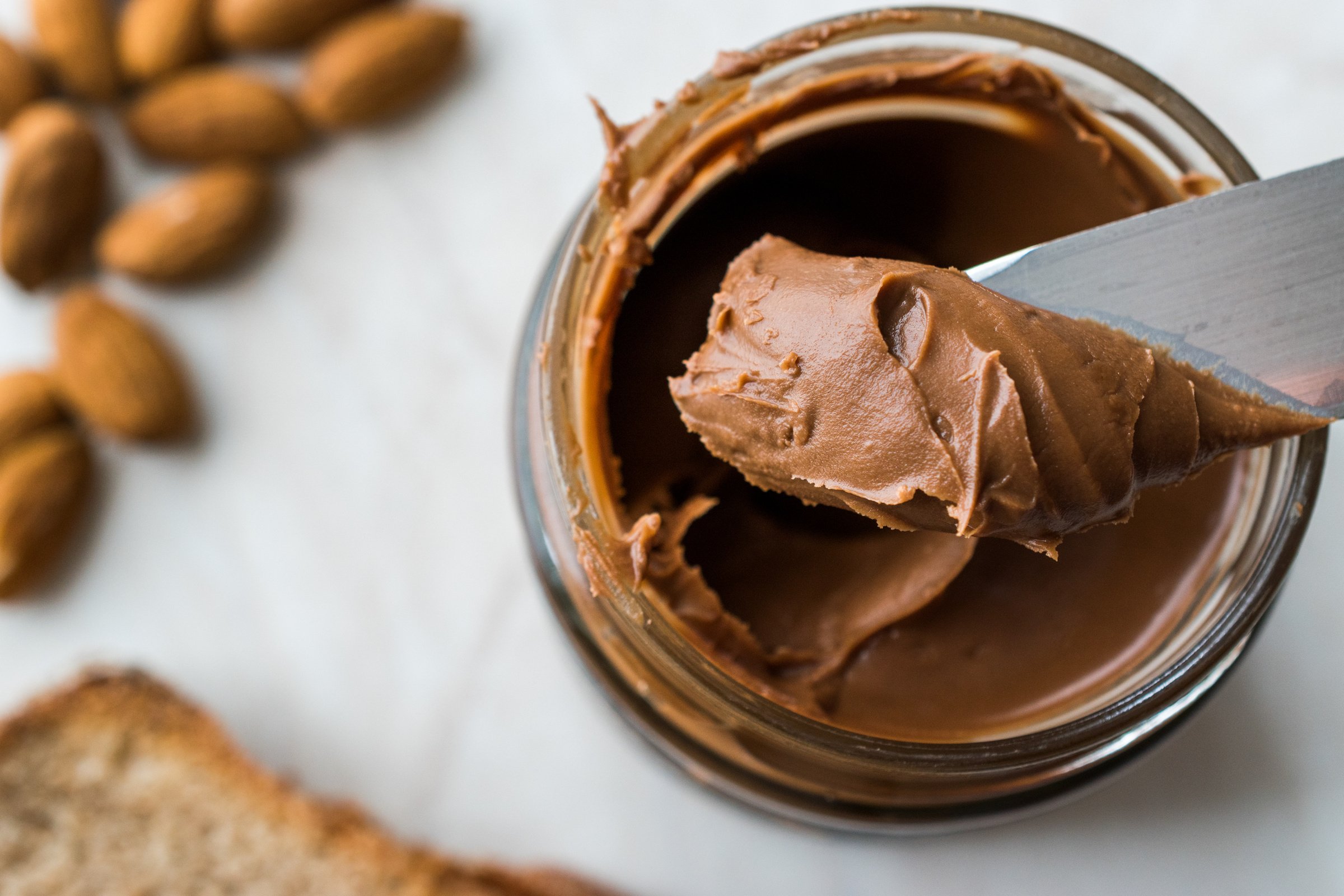 Raw Organic Almond Butter Cream in Jar.